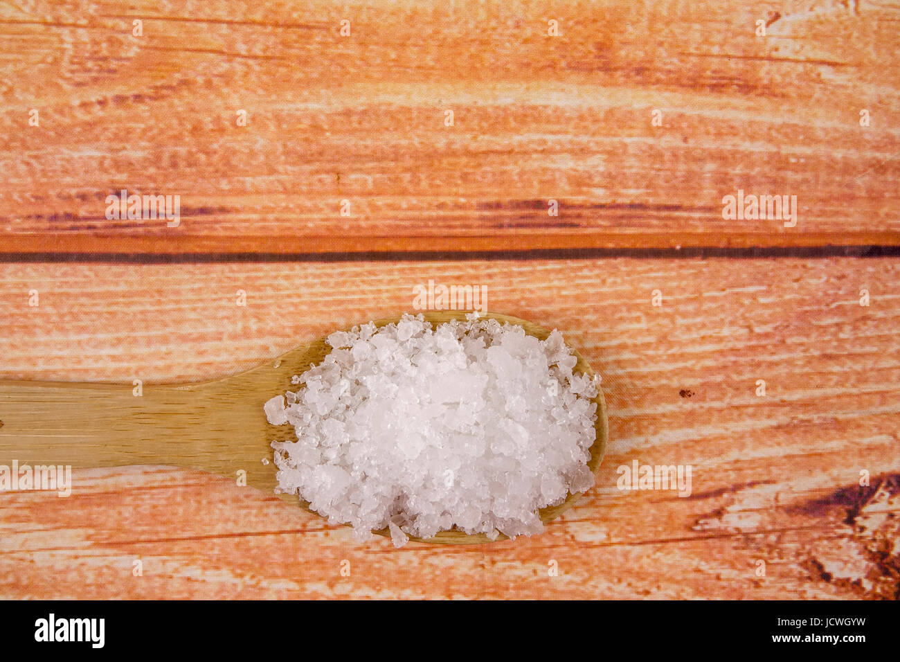 Bay Salt Sea salt in a wooden spoon. Also called bay salt or solar salt, is used ...