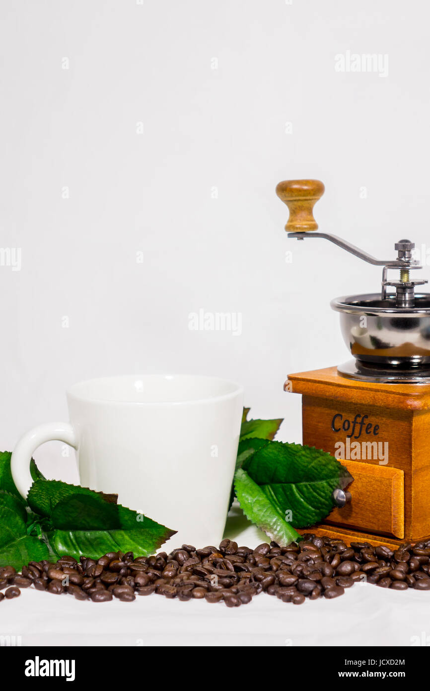 Coffee beans, cups, coffee grinder, vintage on white background Stock