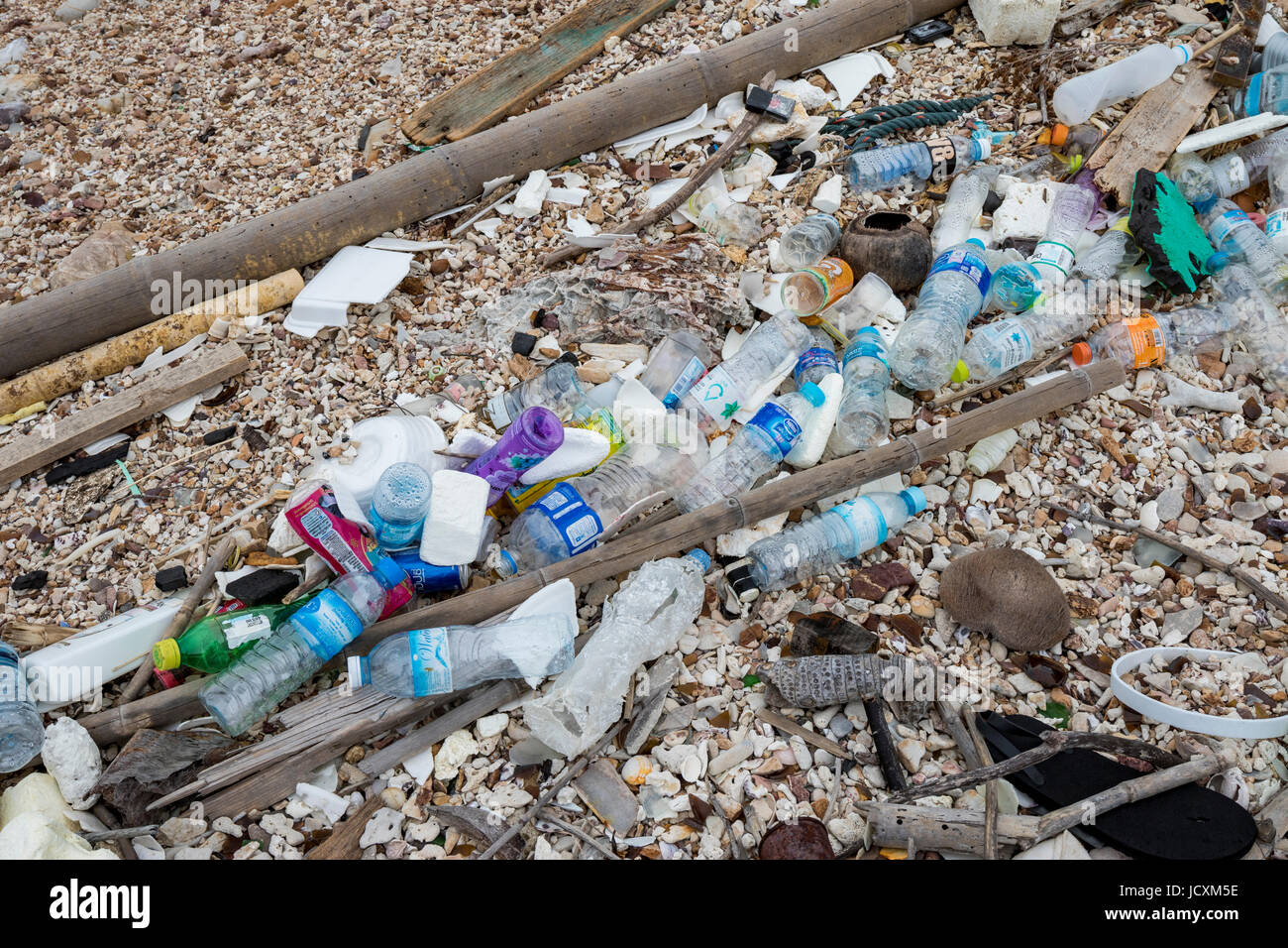 Trash in the ocean washed up on the beach Stock Photo