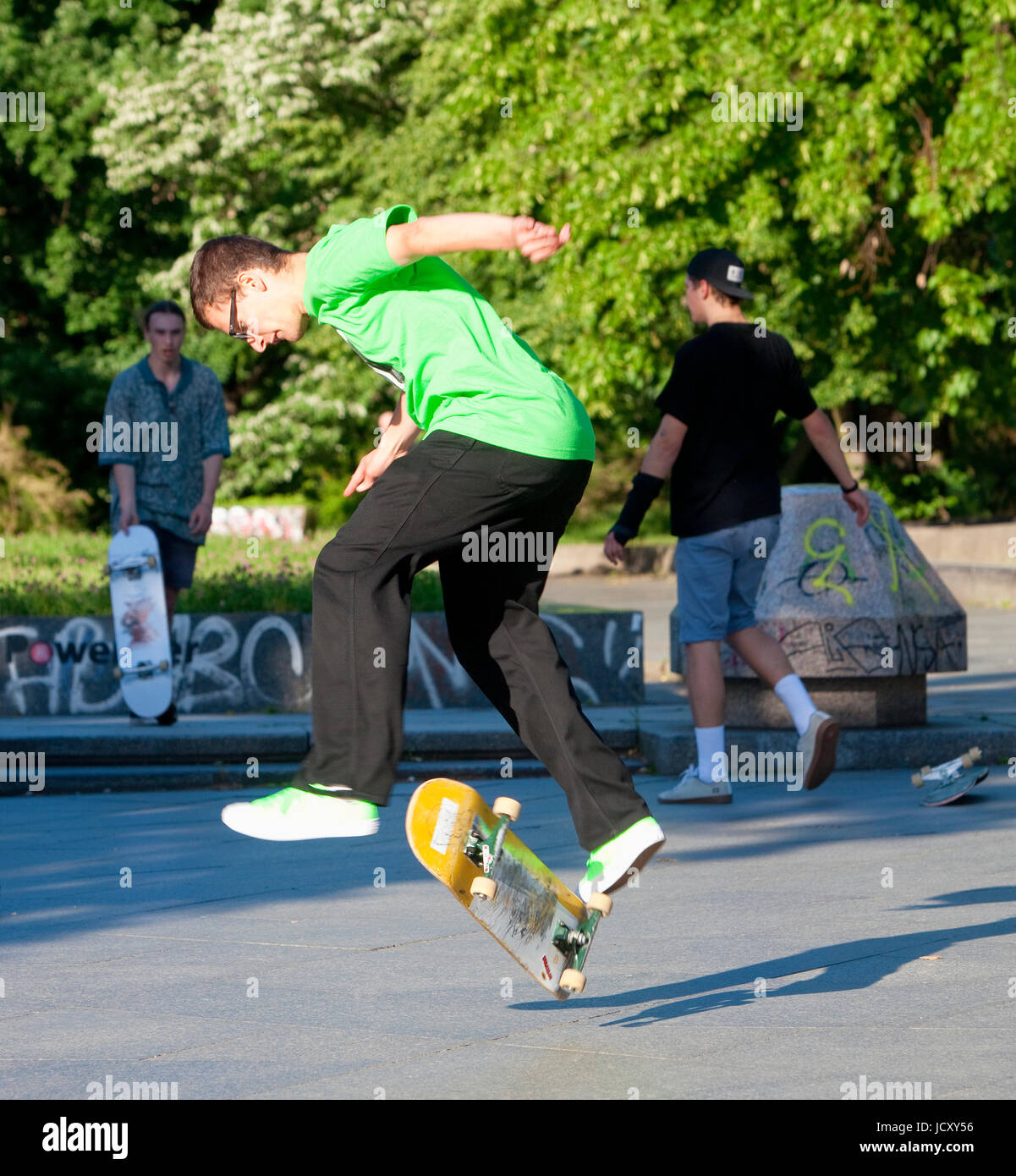 Skateboarding - Skater jumping on  skateboard.. Stock Photo