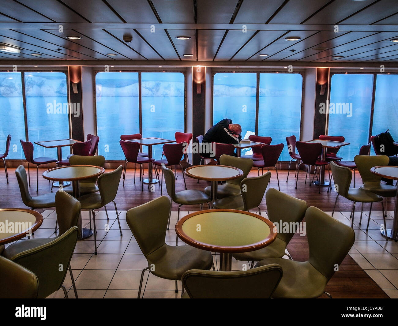 ENGLISH CHANNEL - LORRY DRIVER IN A FERRY HAVING A NAP WHILE ENTERING DOVER HARBOUR - DOVER PORT - DOVER ENGLAND - FERRY © Frédéric BEAUMONT Stock Photo