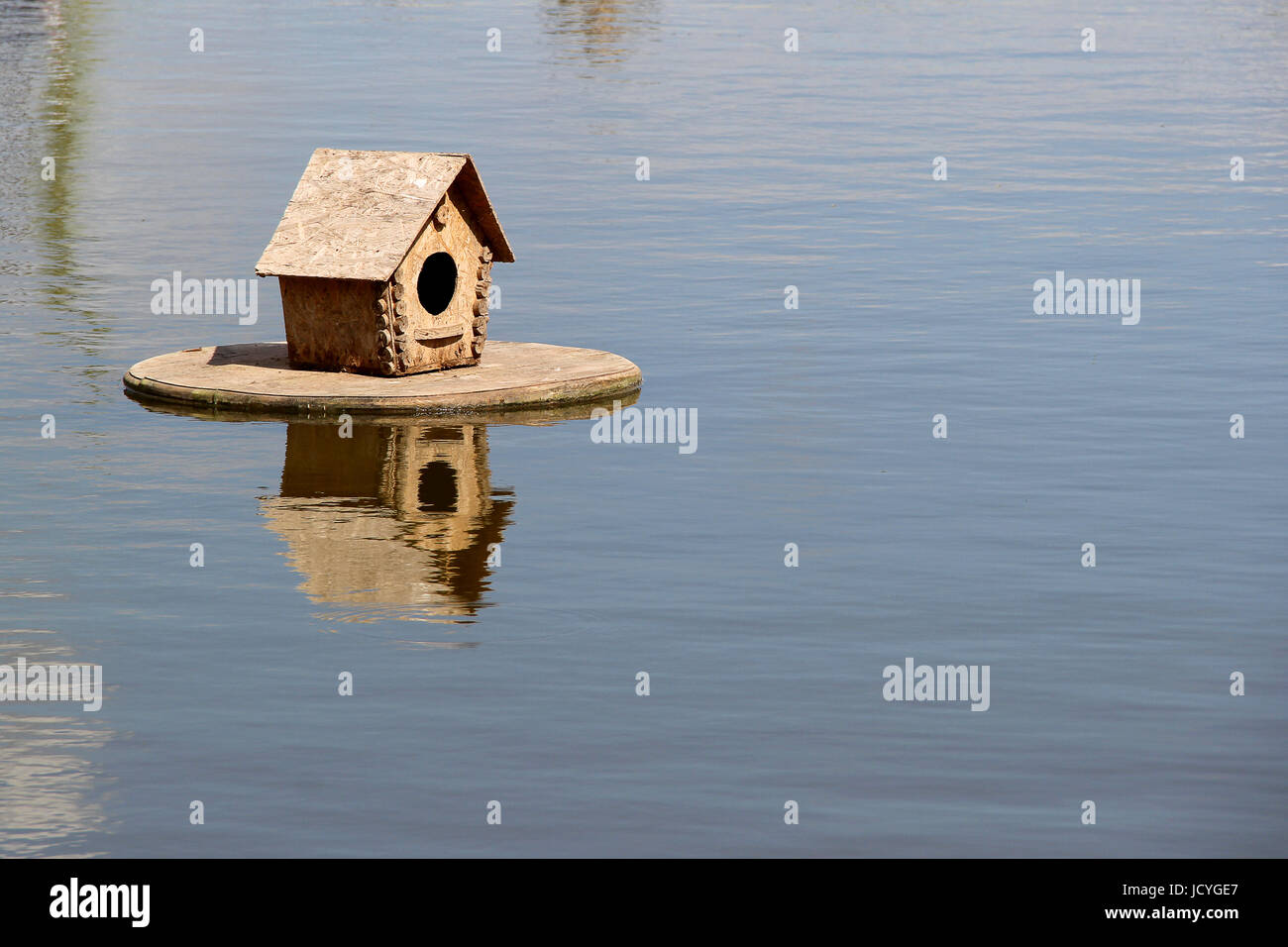 wood Duck house on the lake. photo Stock Photo