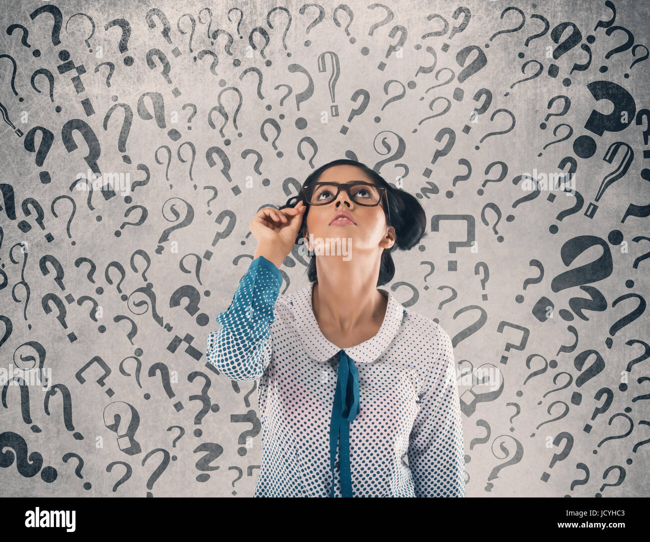 Shocked businessman in front of wall Stock Photo