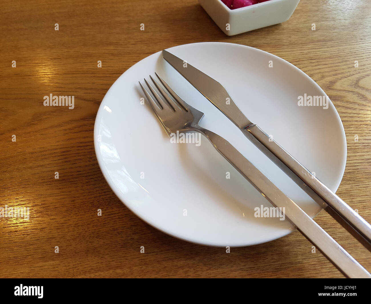 Empty plate, fork and knife Stock Photo Alamy