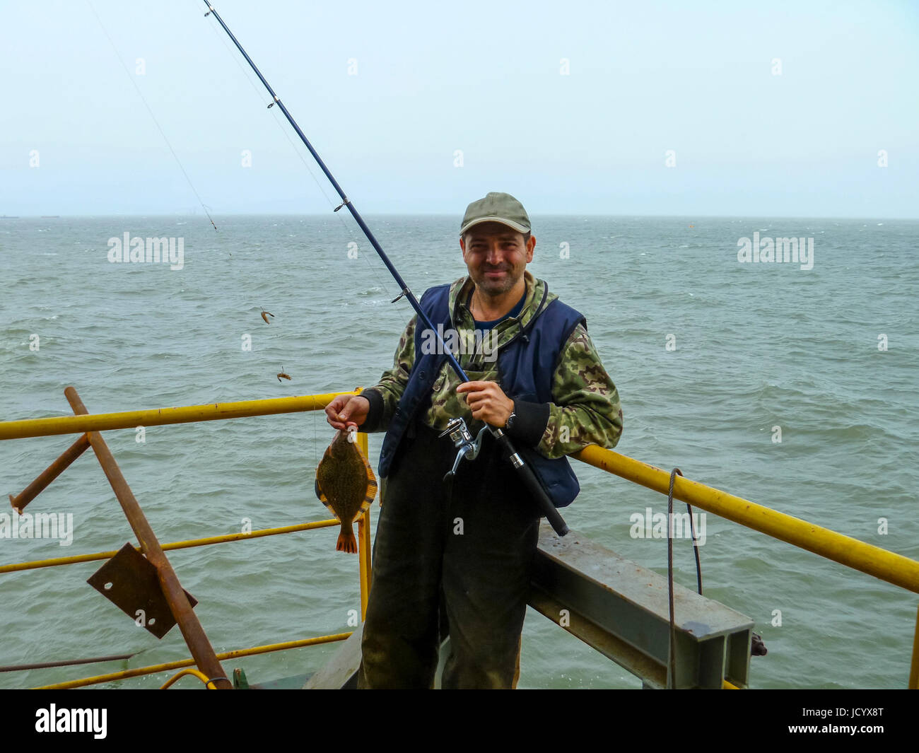 Flounder on the deck. Fishing on the boat. Bottom fish Stock Photo Alamy
