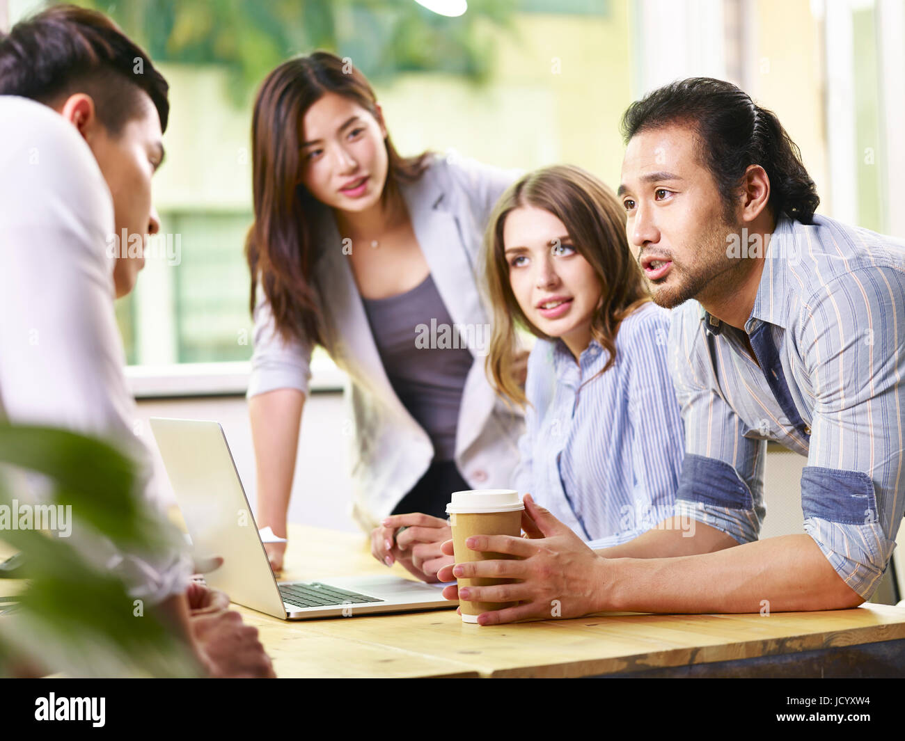 team of multinational businesspeople meeting in office Stock Photo