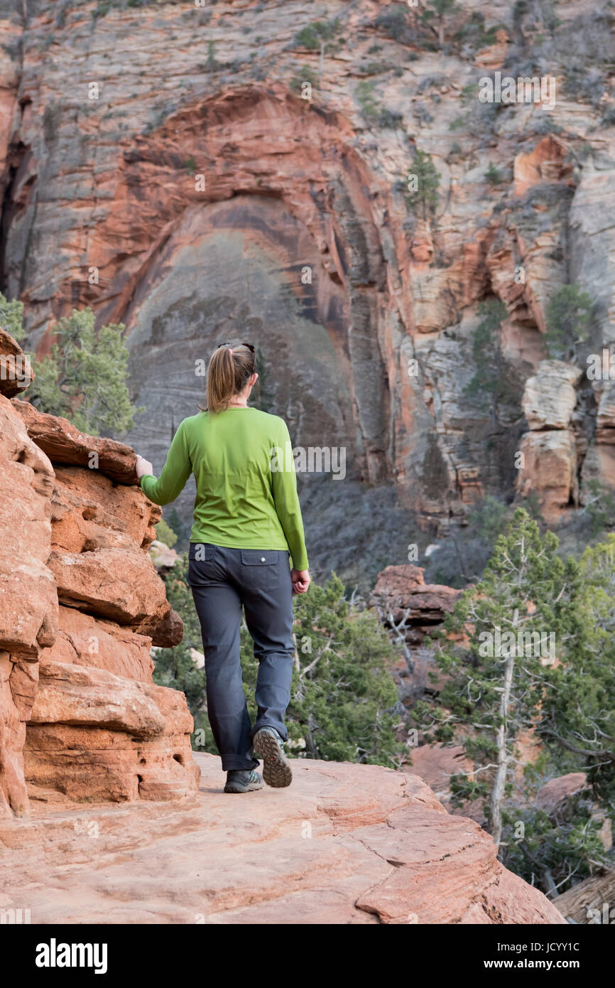 Woman Walks Along Stone Trail Through Canyon Stock Photo - Alamy