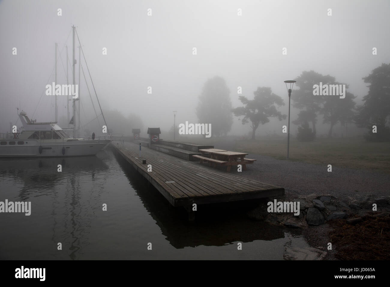 Uto harbour shrouded in mist, Uto, Stockholm County, Sweden. Stock Photo