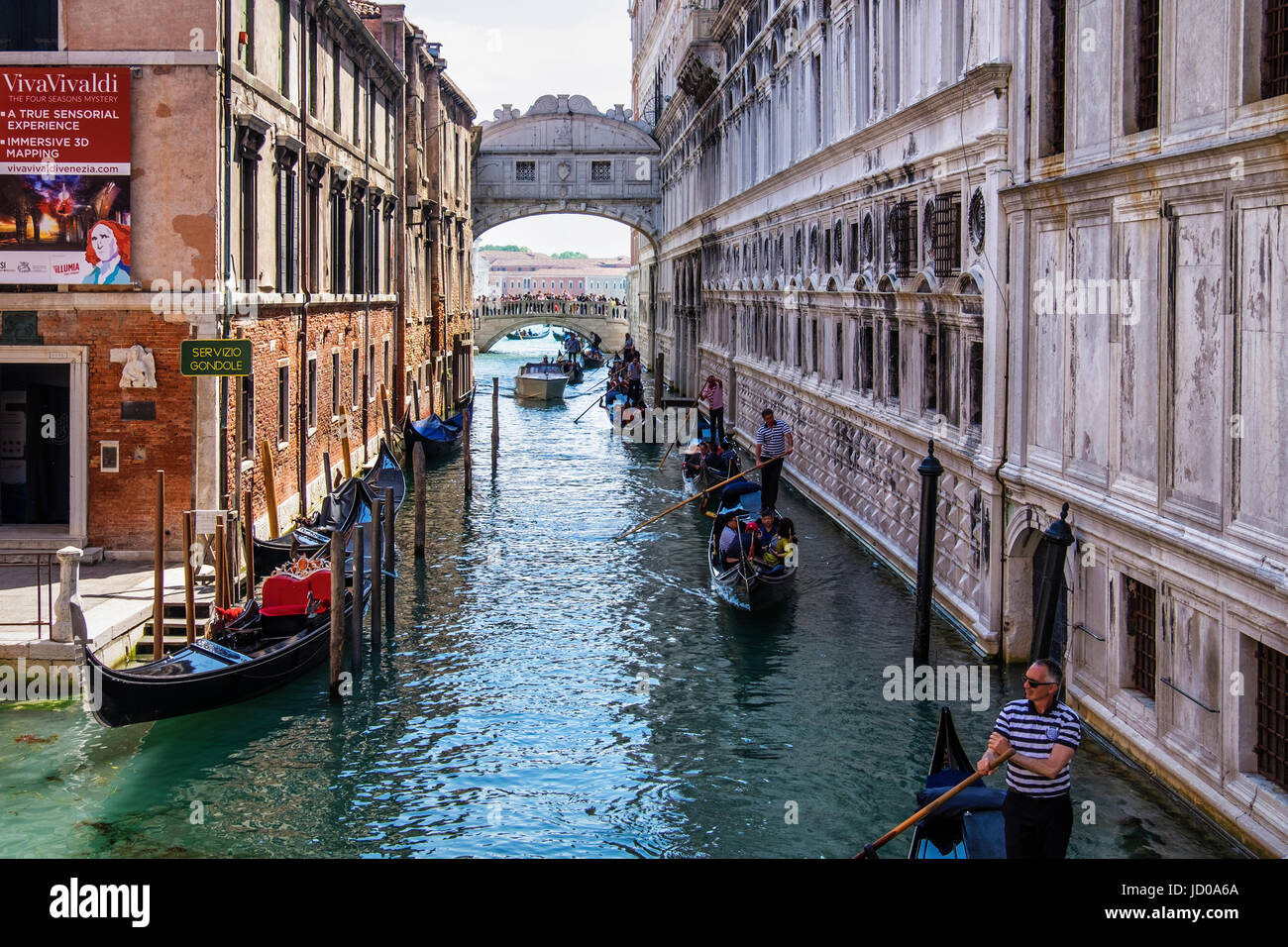 Venice,Italy.Bridge of Sighs,Ponte dei Sospiri over the Rio di Palazzo,Venetian canal view with gondolas and gondoliers Stock Photo