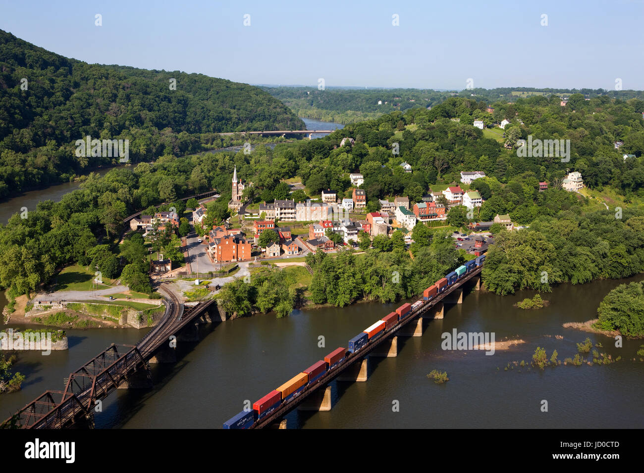 A train rolls across the Shenandoah River in an aerial view of the town of Harpers Ferry, West Virginia, which includes Harpers Ferry National Histori Stock Photo