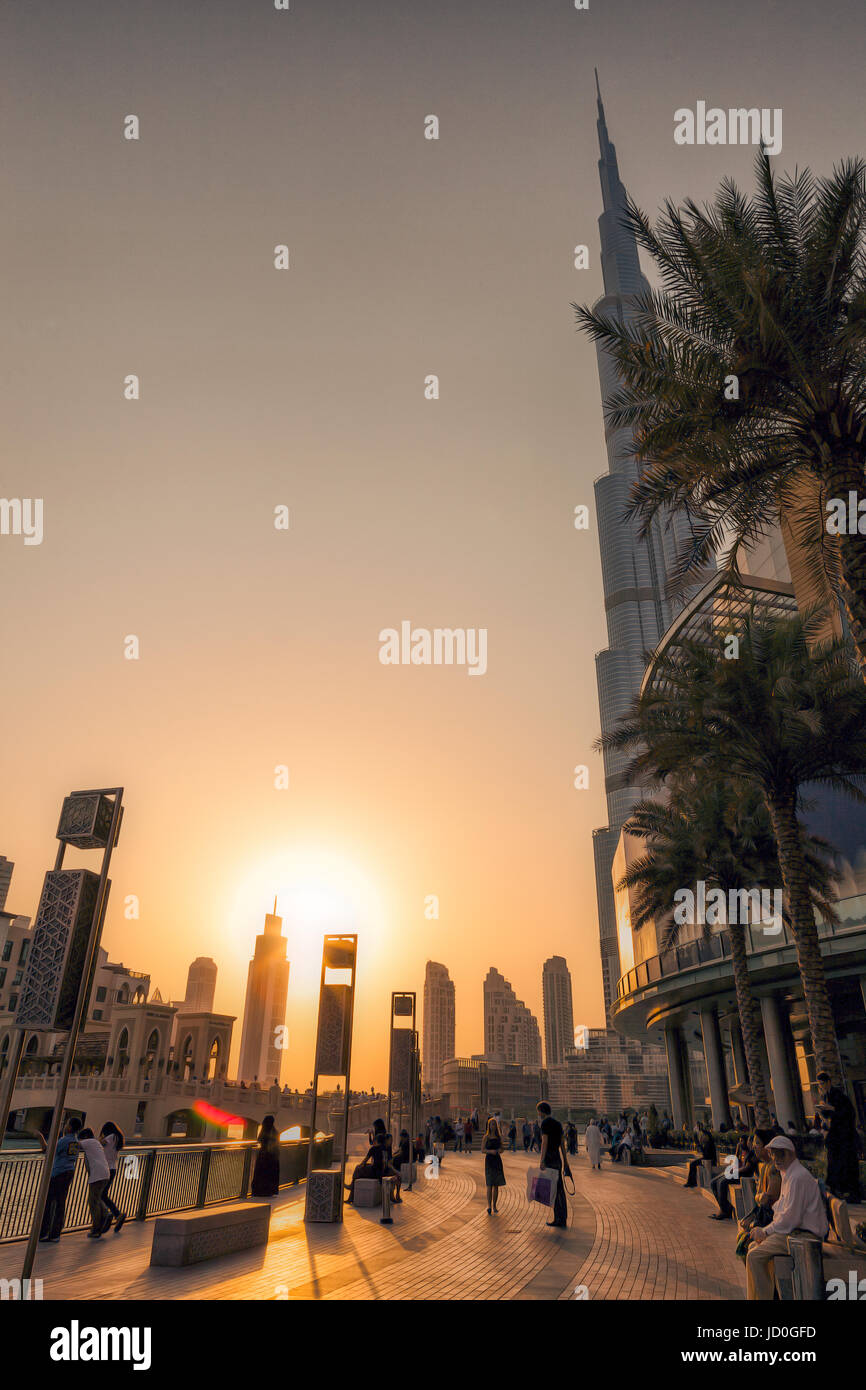 UAE/DUBAI - 14 SEP 2012 - People relaxing on the streets of dubai with sunset Stock Photo