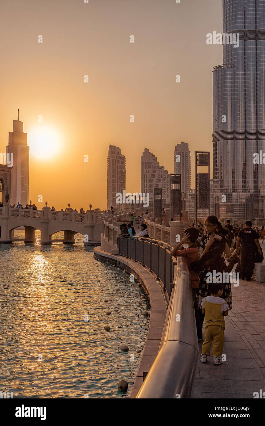 UAE/DUBAI - 14 SEP 2012 - People relaxing on the streets of dubai with sunset Stock Photo