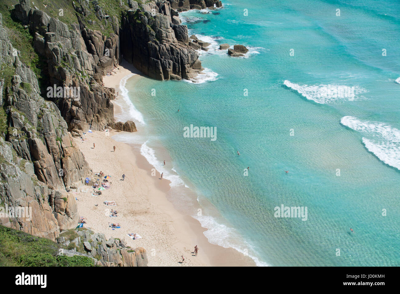 Treen, Cornwall, UK. 17th June, 2017. UK Weather. Some people were stripping off today in the blistering heat in Cornwall, some were covering up, and others were just enjoying the caribbean like sea at Treen. Credit: cwallpix/Alamy Live News Stock Photo