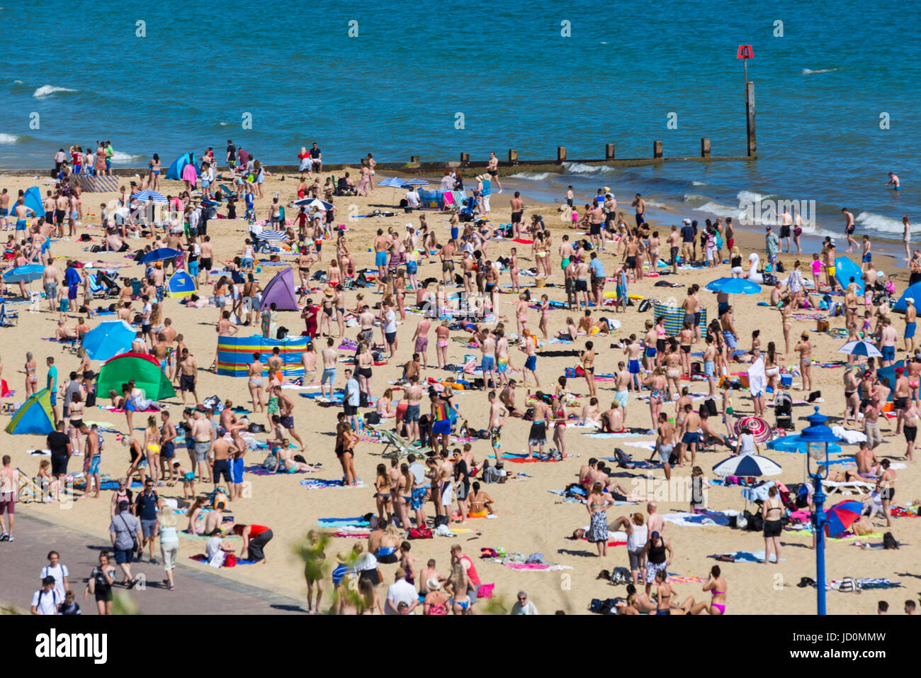 Bournemouth, Dorset, UK. 17th June, 2017. Fire at Bournemouth beach on the hottest day of the year with crowded beaches on a day with hot sunny weather. It was believed a smoke bomb was thrown into the bushes behind the beach huts at Eastcliff which set fire to gorse bushes and went up in smoke as beach goers looked on. Credit: Carolyn Jenkins/Alamy Live News Stock Photo