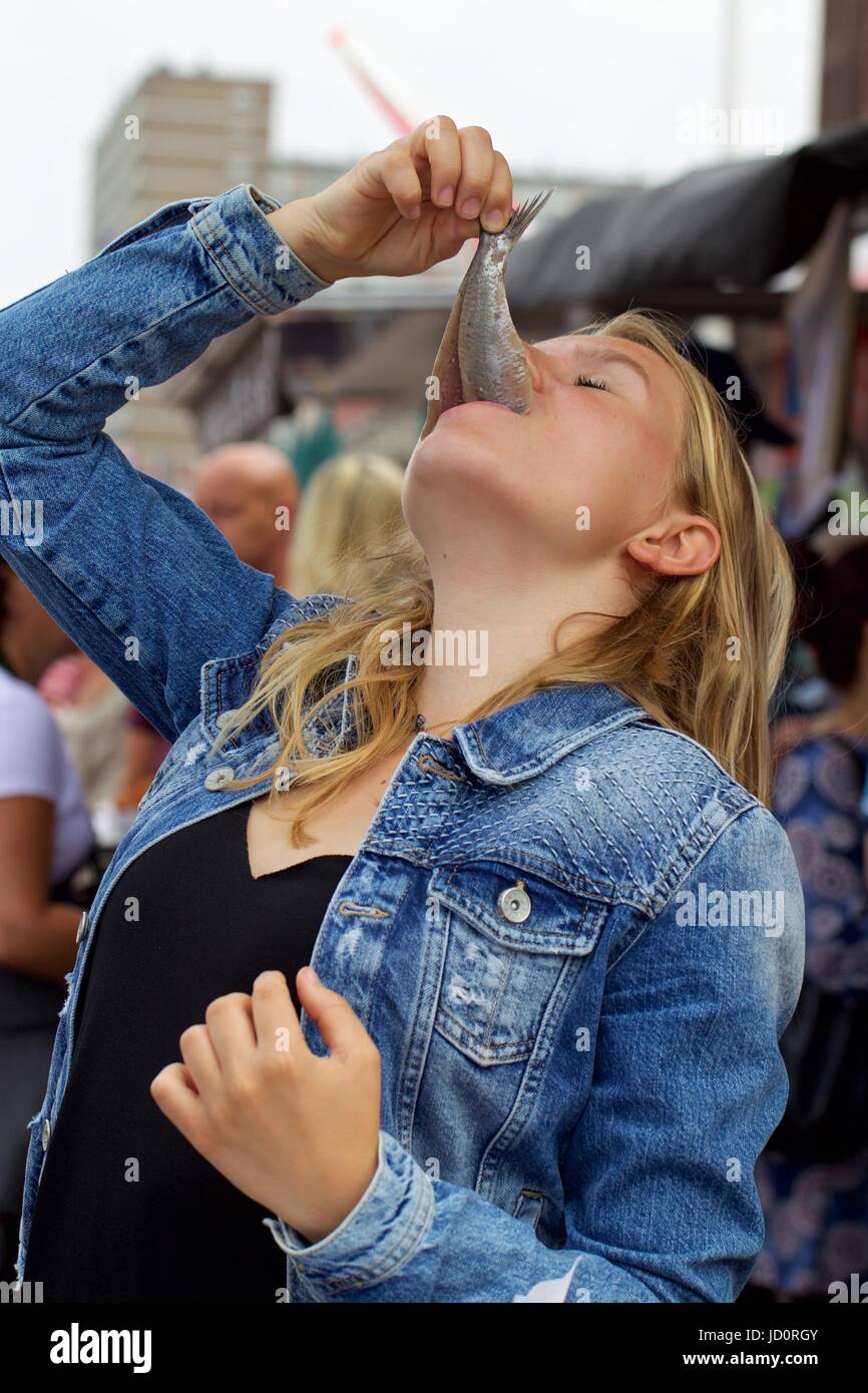 The Hague, Netherlands. 17th June, 2017. A visitor eats a herring at