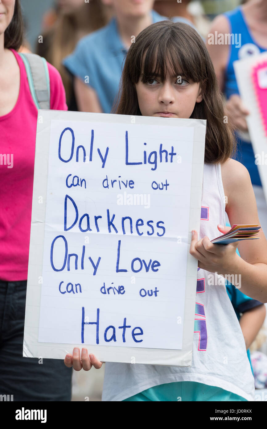 Charleston, South Carolina, USA. 17th June, 2017. A young girl carries a poster during the Hate Won't Win Unity walk to the Mother Emanuel African Methodist Episcopal Church marking the 2nd anniversary of the mass shooting June 17, 2017 in Charleston, South Carolina. Nine members of the historic African-American church were gunned down by a white supremacist during bible study on June 17, 2015. Credit: Planetpix/Alamy Live News Stock Photo