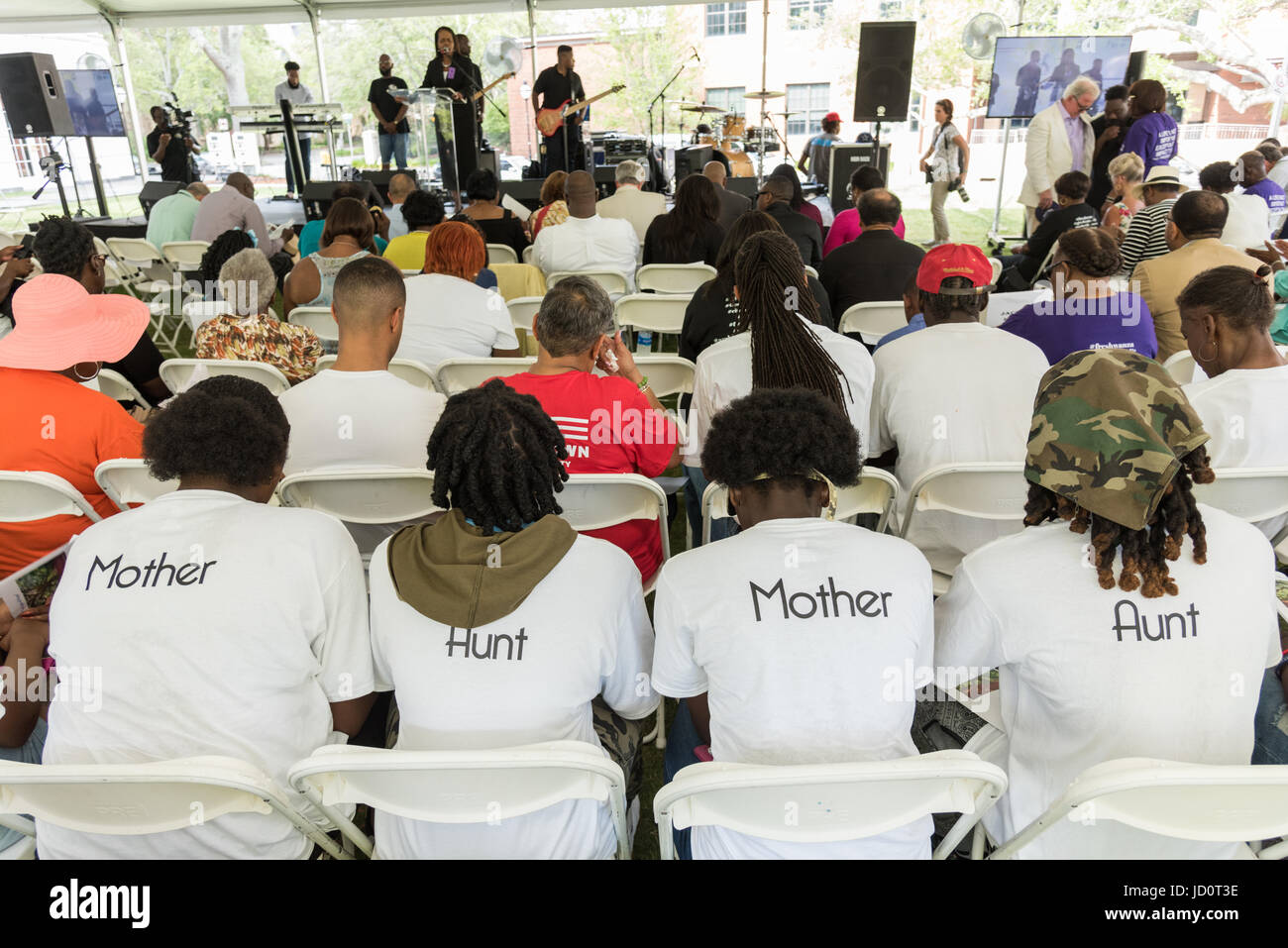 Charleston, South Carolina, USA. 17th June, 2017. Family members of Rev. Depayne Middleton-Doctor, killed in the Mother Emanuel African Methodist Episcopal Church shooting wear shirts with their relationship to the slain pastor during a memorial service marking the 2nd anniversary of the mass shooting June 17, 2017 in Charleston, South Carolina. Nine members of the historic African-American church were gunned down by a white supremacist during bible study on June 17, 2015. Credit: Planetpix/Alamy Live News Stock Photo