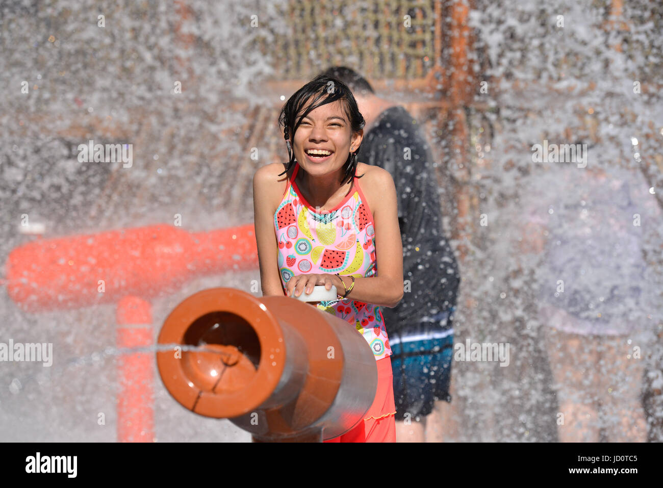 June 15, 2017 - Kids play at Morgan's Inspiration Island, the world's first ultra-accessable splash park for those with and without special needs, has opened in San Antonio, Texas. The tropical island themed park cost $17 million and features six major area's for children and adults to play. Every Inspiration Island area is wheelchair-accessable and features revolutionary wheelchairs that are powered by compressed air for those who have battery powered chairs that aren't waterproof. Waterproof writsbands featuring RFID technology help parents can easily ascertain where their children are at Stock Photo