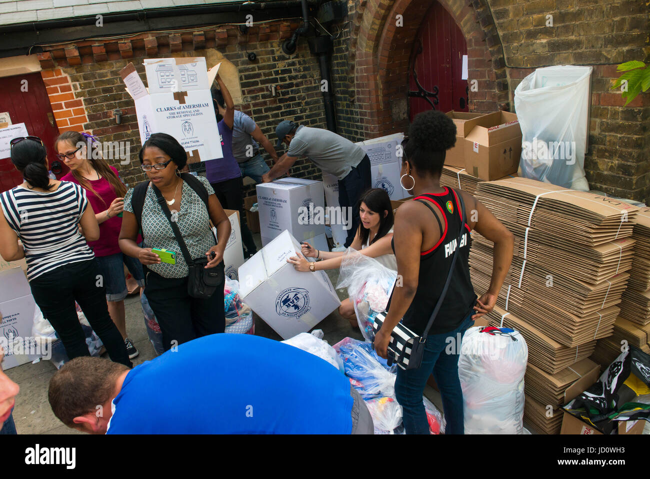 London, United Kingdom. 17th June 2017. Volunteers help distribute items to help those affected by the fire at Grenfell Tower, following the June 14 fire. Michael Tubi / Alamy Live News Stock Photo