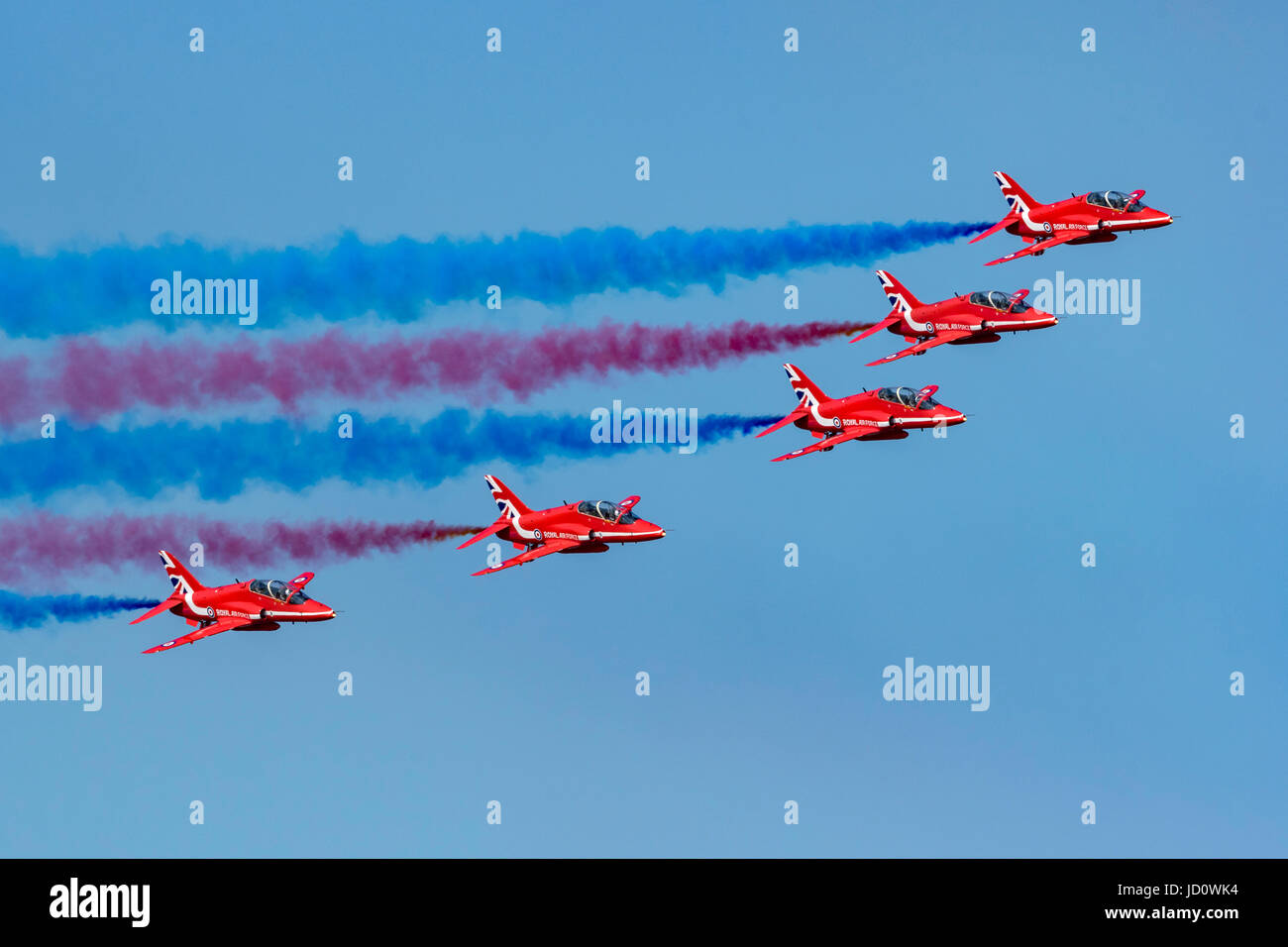 Weston-super-Mare, UK. 17th June, 2017. The RAF Red Arrows Aerobatic Team carr out a stunning display in blue summer skies at Weston Air Festival, located in Weston-super-Mare, UK. Credit: Bob Sharples/Alamy Live News Stock Photo