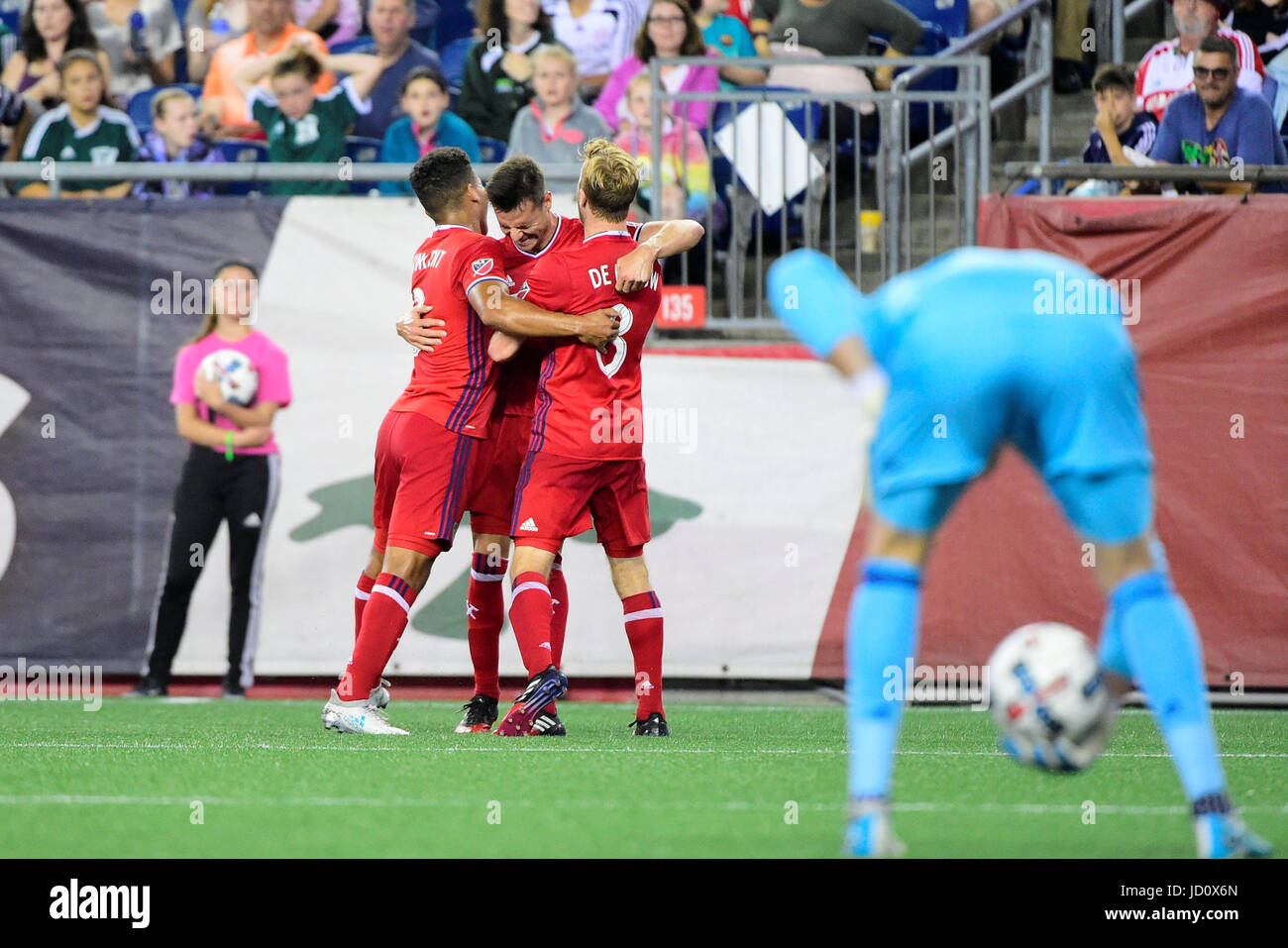 Foxborough Massachusetts, USA. 17th June, 2017. Chicago Fire forward Luis Solignac (9) (center) celebrates his goal with defender Brandon Vincent (3)(left) and midfielder Michael de Leeuw (8)(right) during the MLS game between Chicago Fire and the New England Revolution held at Gillette Stadium in Foxborough Massachusetts. Chicago defeats New England 2-1. Eric Canha/CSM/Alamy Live News Stock Photo