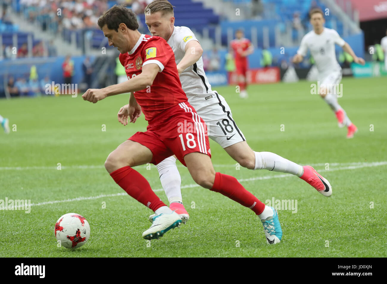 St. Petersburg, Russia. 17th June, 2017. Yury Zhirkov (L) of Russia vies with Kip Colvey of New Zealand during the group A match between Russia and New Zealand of the 2017 FIFA Confederations Cup in St. Petersburg, Russia, on June 17, 2017. Russia won 2-0. Credit: Xu Zijian/Xinhua/Alamy Live News Stock Photo