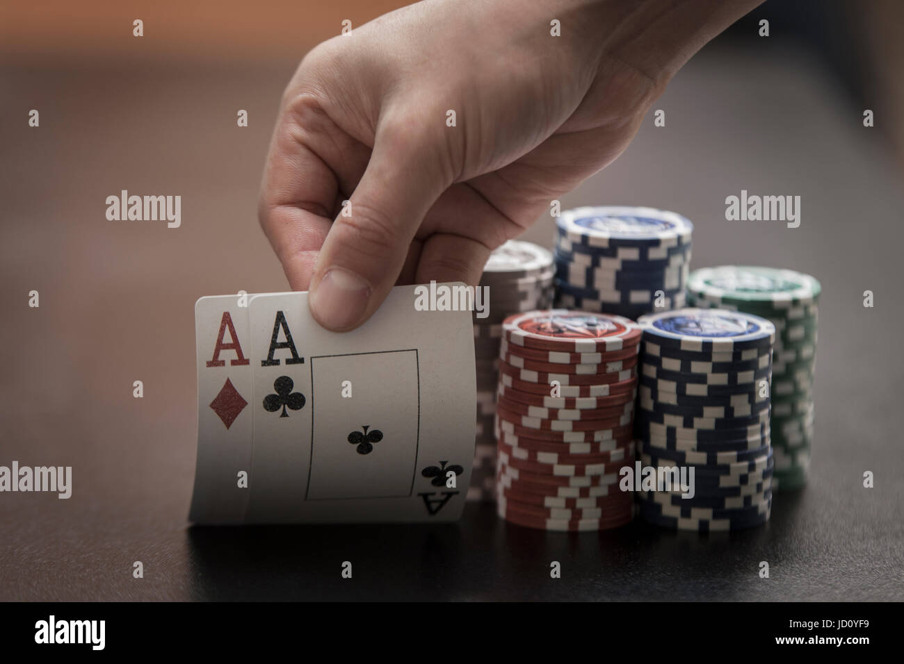 Man's hands show his winner hands, aces card Stock Photo