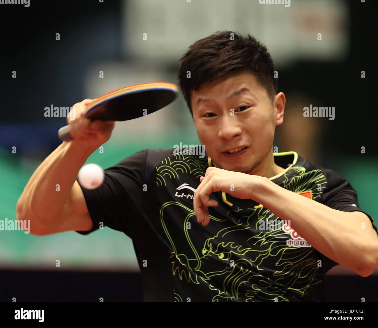 Tokyo, Japan. 18th June, 2017. Chinese table tennis player Ma Long returns the ball against his