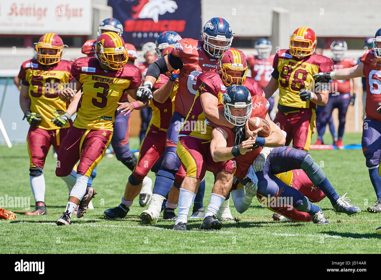 Chur, Switzerland. 18th June, 2017. Broncos attack is stopped by Warriors during the American Football match Calanda Broncos vs. Winterthur Warriors. © Rolf Simeon/Alamy Live News. Stock Photo