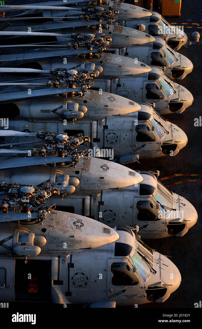 SH-60 Seahawk helicopters sit on the flight deck aboard the Nimitz-class aircraft carrier USS Harry S. Truman (CVN 75) in the early morning sun. U.S. Navy photo/ Photographer's Mate Airman Ricardo J. Reyes Stock Photo