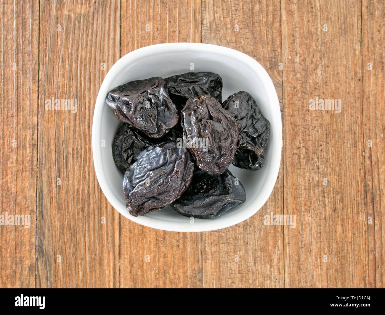 Portin of prunes. Dried plums. High in roughage, iron and boron. Stock Photo
