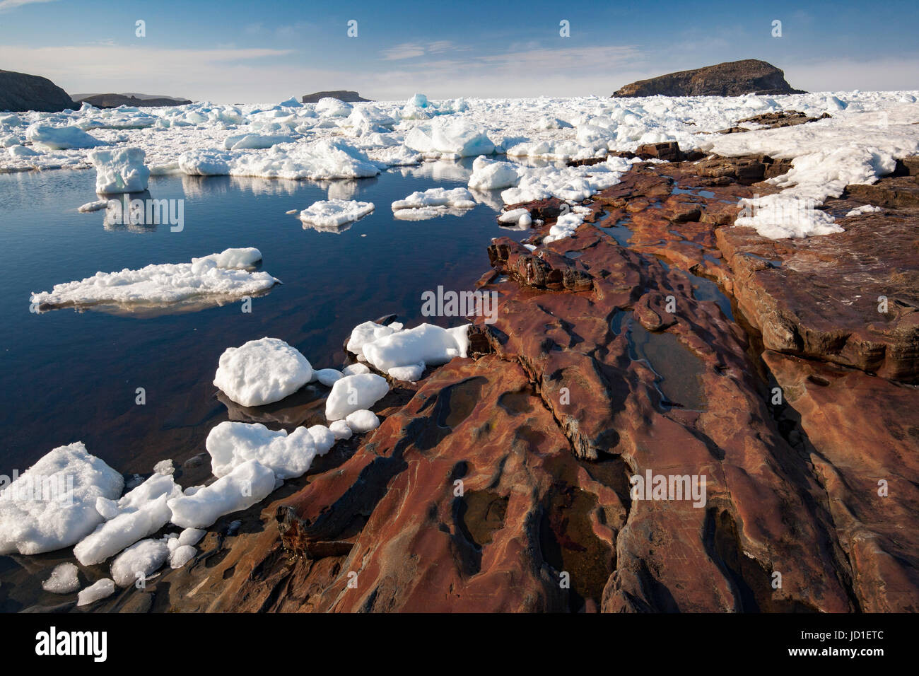 Rocky coastline and sea ice landscape in Maberly, near Elliston on Cape Bonavista, Newfoundland, Canada Stock Photo
