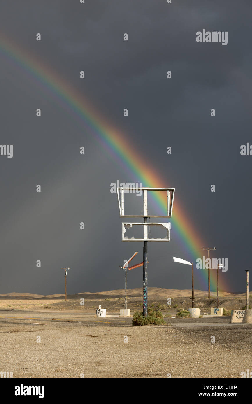 Rainbow over an abandoned gas station in Coaldale, Nevada. Stock Photo