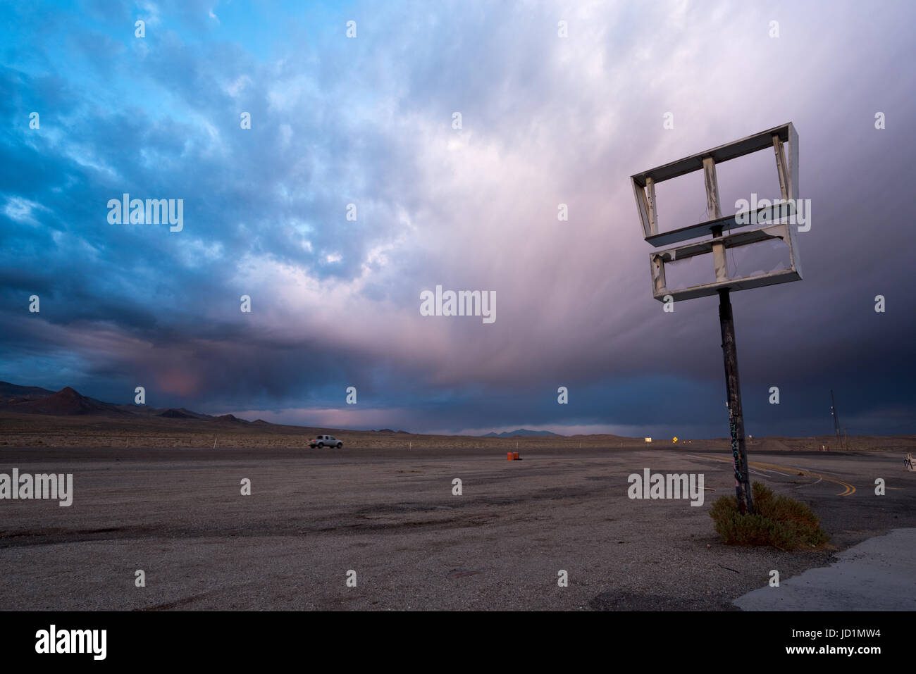 Sunset storm over U.S. 95 and an abandoned gas station in Coaldale, Nevada. Stock Photo