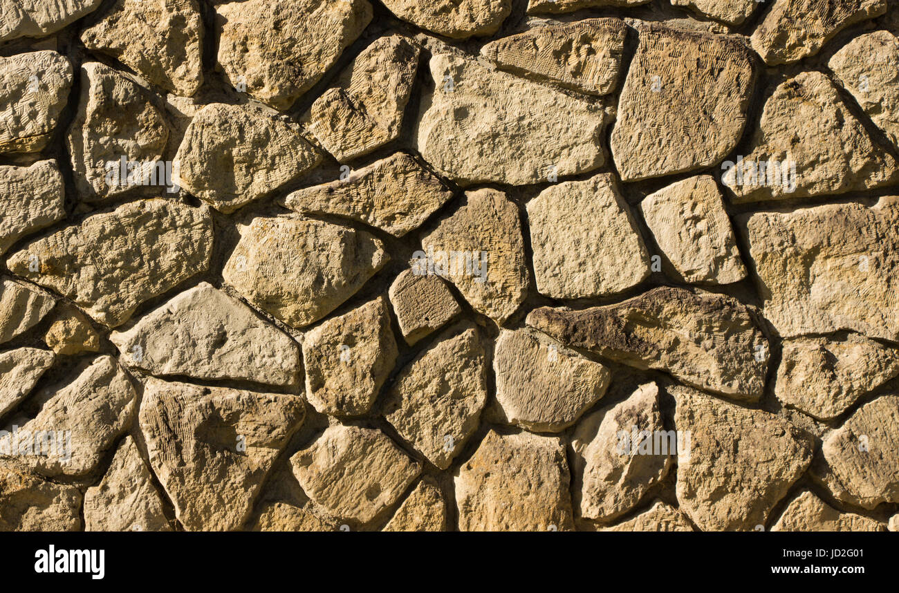 Rock wall texture, rock fitted together like a puzzle Stock Photo - Alamy