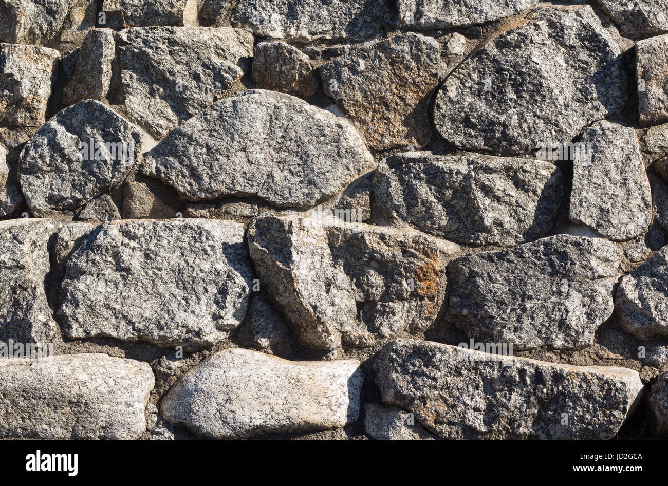 Bumpy Rocks Wall Wall made of rough rocks Stock Photo - Alamy