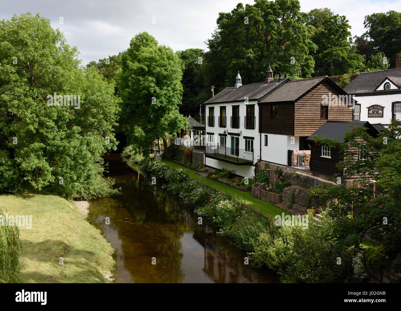 Black and white timber frame house at the side of the river in Berriew village in powys mid wales uk Stock Photo
