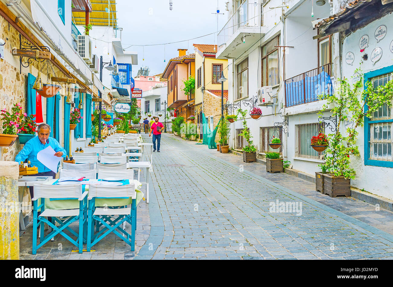 ANTALYA, TURKEY - MAY 6, 2017: It's easy to find some cosy cafe or scenic restaurant, walking along the old narrow streets of Kaleici, on May 6 in Ant Stock Photo