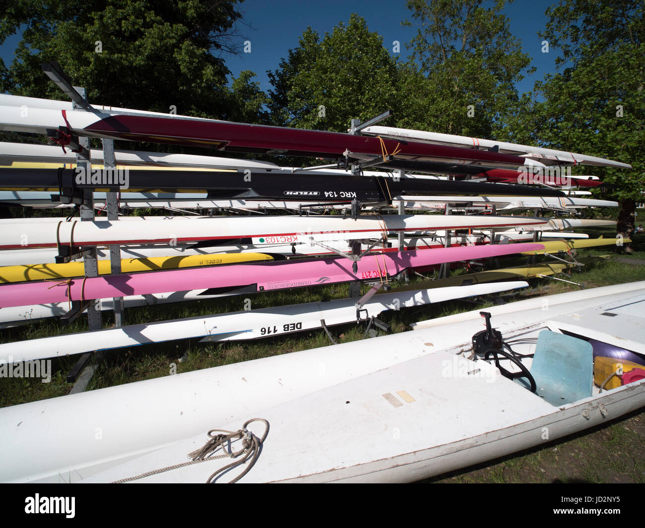 Multi Coloured Bright Rowing Eights 8 Stacked Outside A Boathouse JD2NY5 