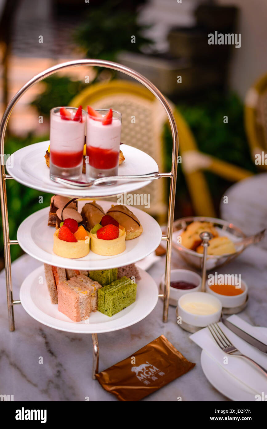 three tier afternoon tea set and pastries Stock Photo - Alamy