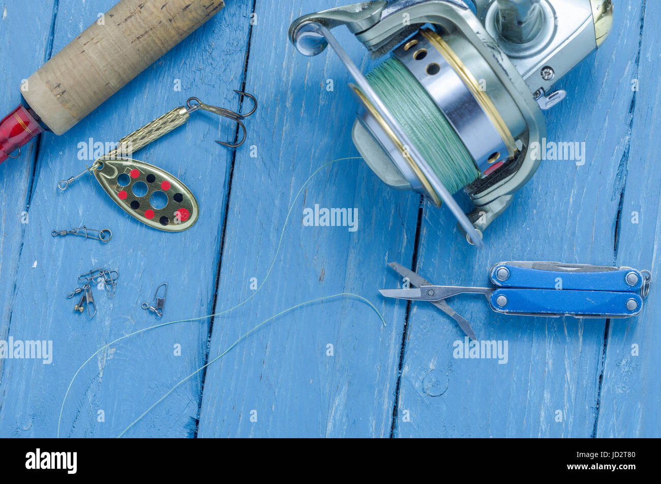 Metal spinners in the shape of a spoon of different colors for catching a  predator on a vintage wooden background. The concept of choosing bait for  di Stock Photo - Alamy