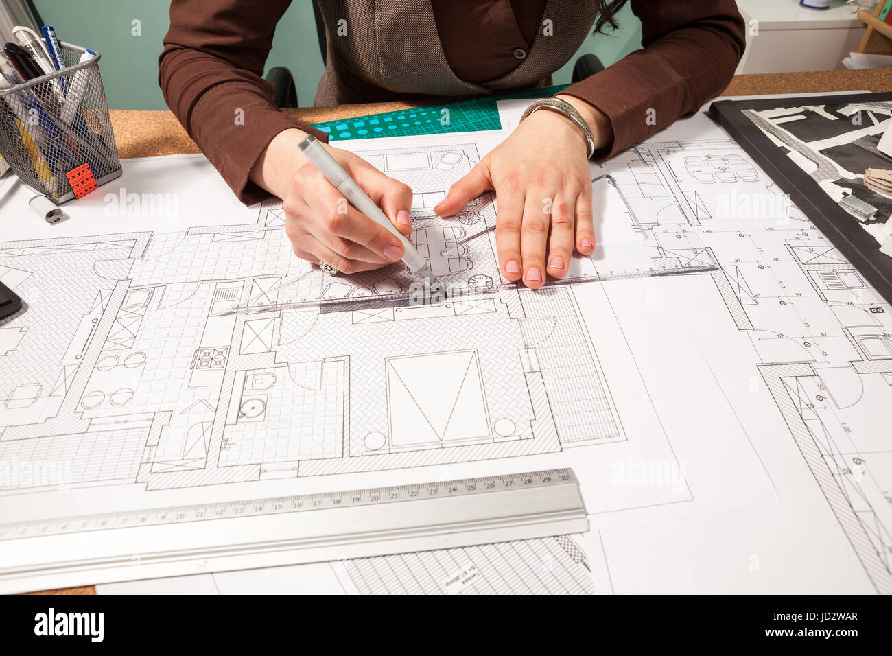 Close up of architect working on blueprints Stock Photo - Alamy