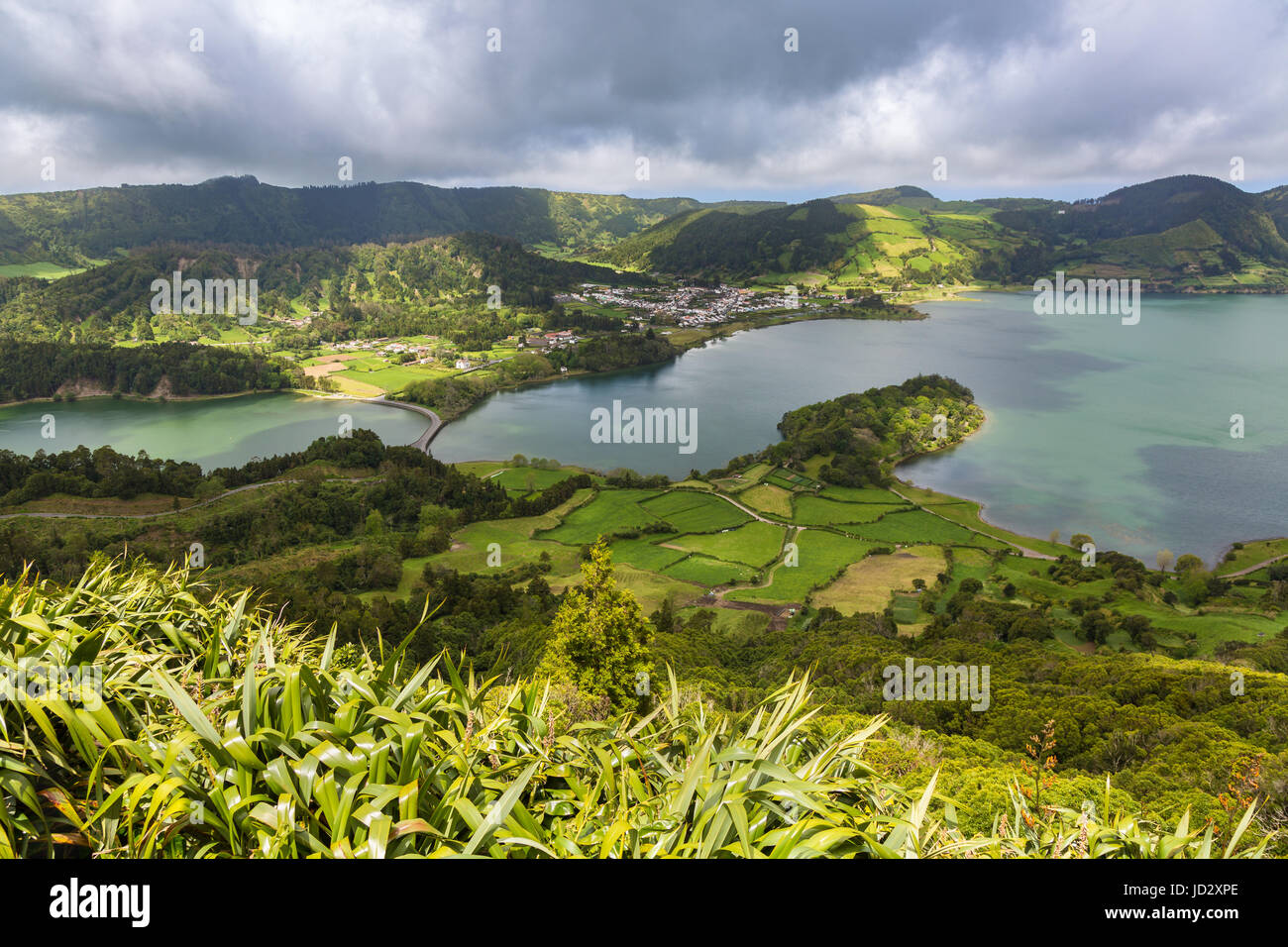 Blue and green lake in the volcano craters of the island of Sao Miguel, part of the Azores. Stock Photo