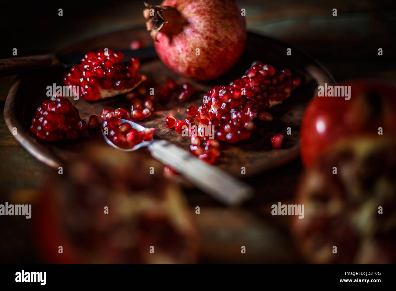 Red juice pomegranate on vintage background Stock Photo