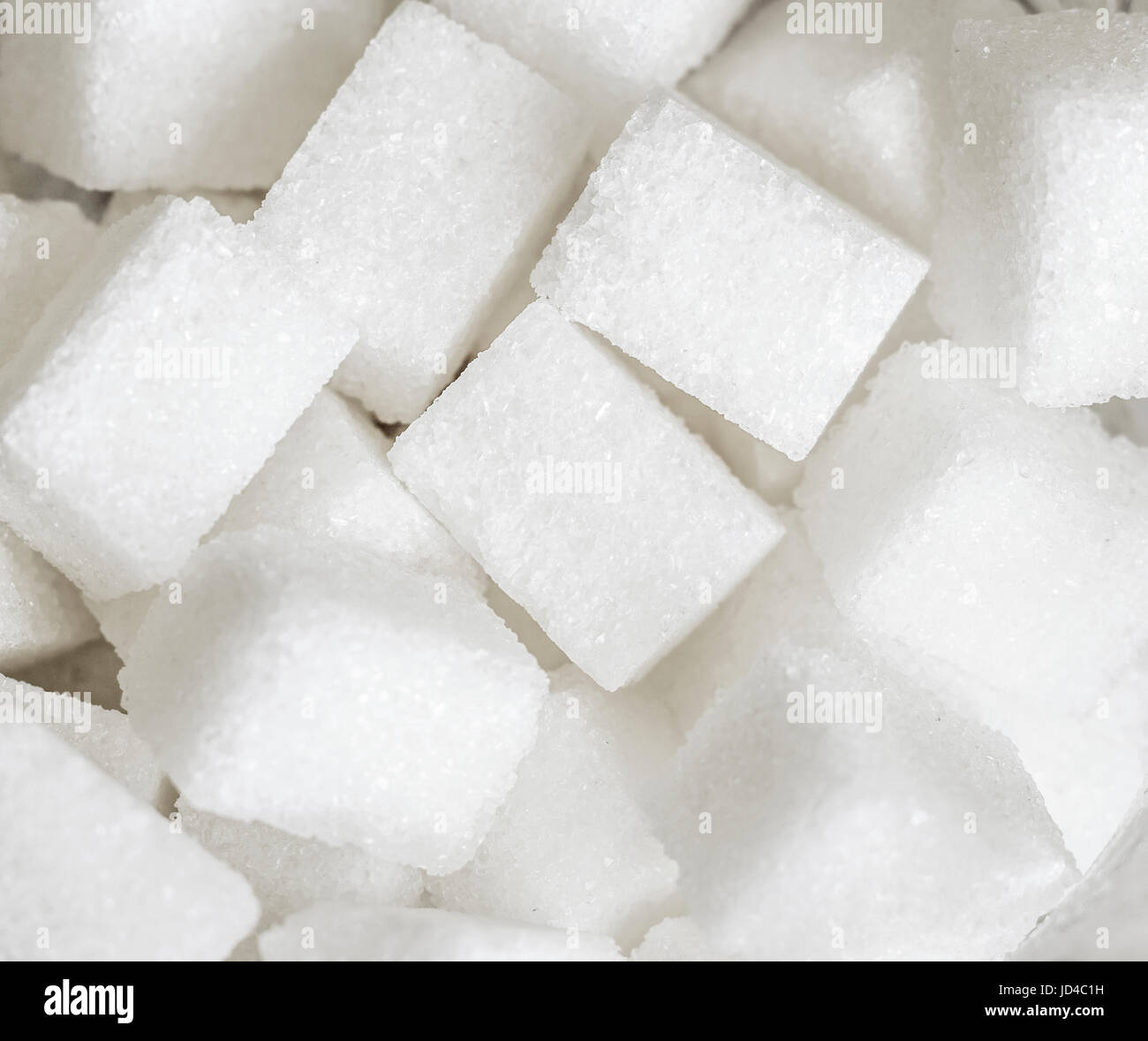 White Sugar cubes closeup Stock Photo - Alamy