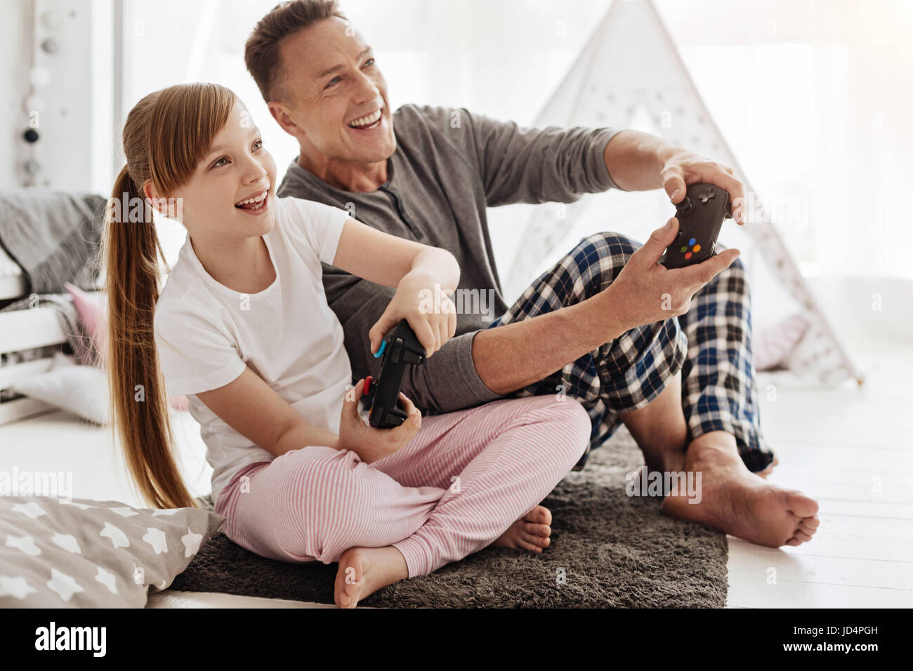 Passionate active family having fun with video games Stock Photo