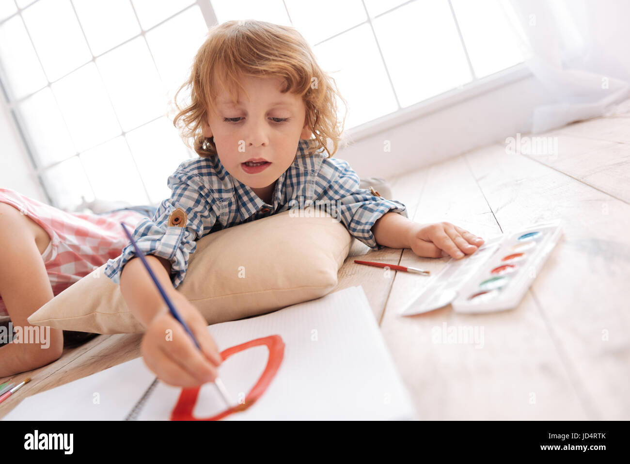 Cute skillful boy painting a picture Stock Photo