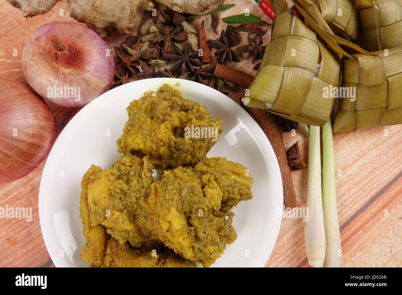 Malaysian Dish Rendang Ayam Or Dry Curry Chicken And Ketupat Nasi (Rice ...