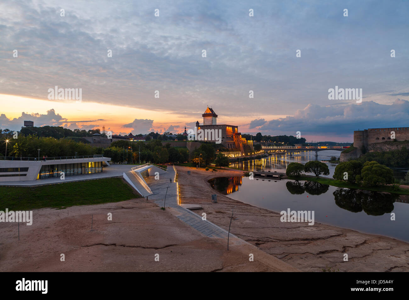 Opposition of two medieval fortresses on the river Narva at sunset, Estonia and Russia border Stock Photo