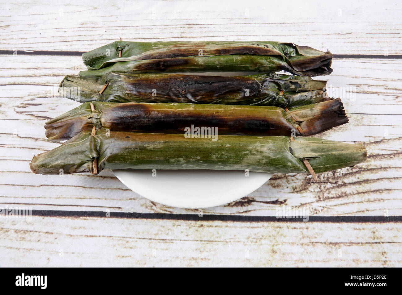 Pulut panggang or grilled glutinous rice package, Malay or Nonya cuisine most popular in Malaysia Stock Photo